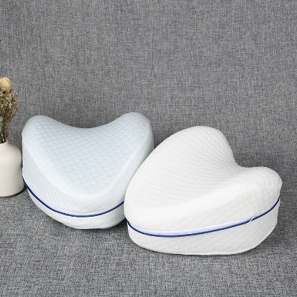 Zero pressure memory foam leg lock pillows in white with blue trim on gray fabric background