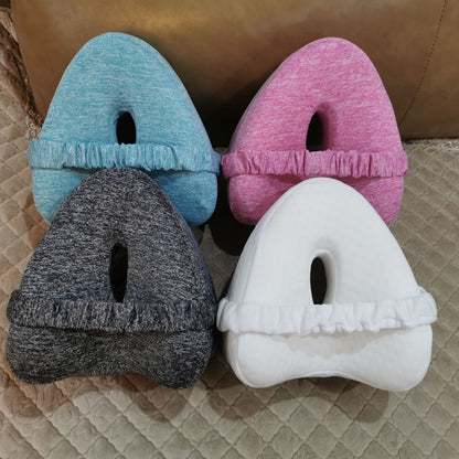 Zero pressure memory foam leg lock pillows in blue, pink, black, and white with ergonomic design and fabric cover